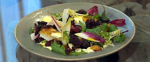 Warm salad of black pudding, potatoes and bacon with curried haddock